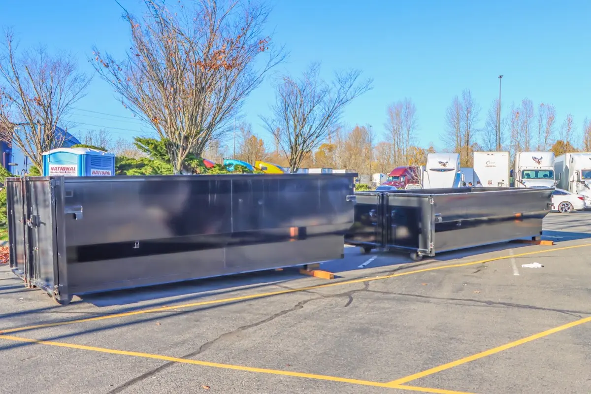 Professional dumpster rental service with roll-off container on residential driveway in Worthington